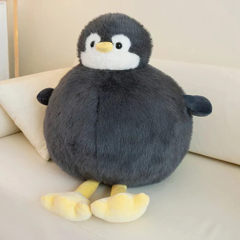 Fyldig rund pinguin krammedyr i blødt stof